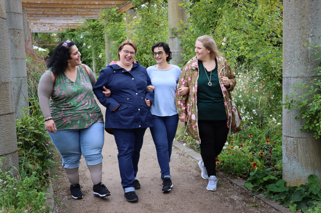 a group of women standing next to each other.
