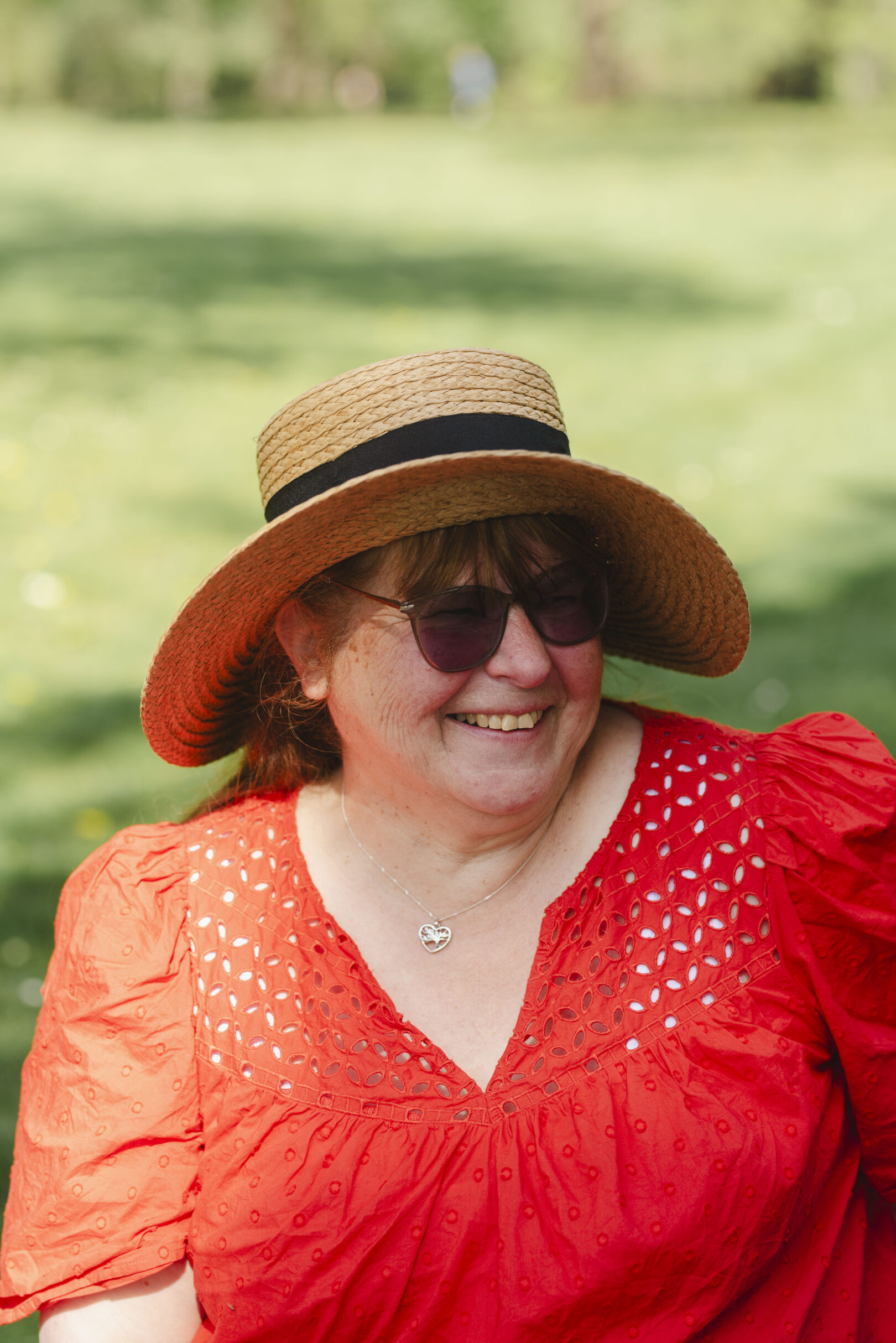 Female in vibrant red top wearing a hat. Image provided courtesy of Leeds Beckett University - leedsbeckett.ac.uk